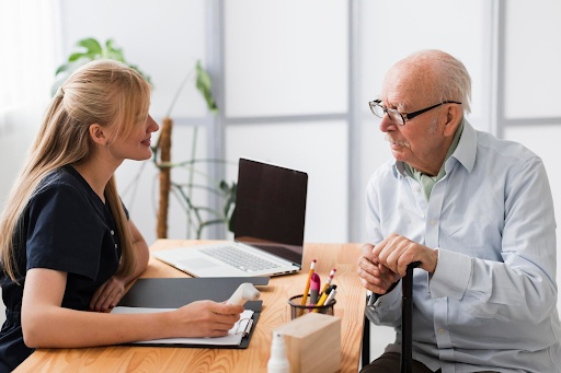 Elderly man talking to a Doctor