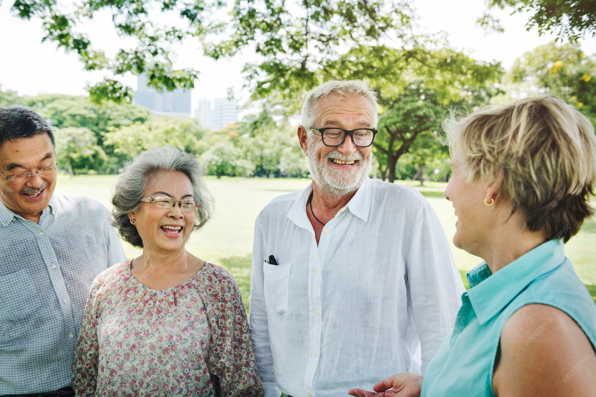 A group of older adults smiling at each other.