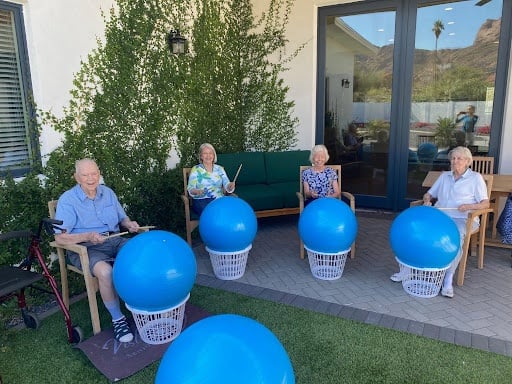 Residents doing an activity with their exercise ball