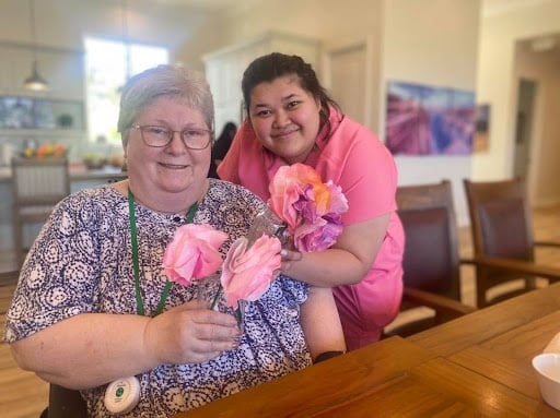Compassionate caregiver spending time with a senior resident in a Phoenix senior care community